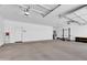 Spacious three-car garage with ample room for parking and storage at 19711 W Colter St, Litchfield Park, AZ 85340