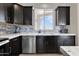 Kitchen sink, dishwasher, cabinets, and countertops at 19711 W Colter St, Litchfield Park, AZ 85340