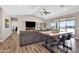 Bright and airy living room with vaulted ceilings, sleek floors, comfortable seating, and backyard access at 19711 W Colter St, Litchfield Park, AZ 85340