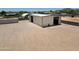 Exterior view of a workshop on a large lot with an open door at 19711 W Colter St, Litchfield Park, AZ 85340
