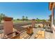 Relax on the balcony with views of the golf course and community amenities on a sunny day at 19719 N Castille Dr, Maricopa, AZ 85138