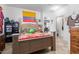 This bedroom has a wooden bed frame and a window for natural light at 19719 N Castille Dr, Maricopa, AZ 85138
