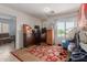 Bedroom filled with furniture including a wooden dresser and a window view at 19719 N Castille Dr, Maricopa, AZ 85138