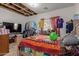 This bedroom has a closet rack and curtains over the window for natural light at 19719 N Castille Dr, Maricopa, AZ 85138