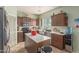 Modern kitchen with updated appliances, kitchen island, and light countertops at 19719 N Castille Dr, Maricopa, AZ 85138