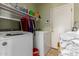 Efficient laundry room featuring a side-by-side washer and dryer and plenty of storage at 19719 N Castille Dr, Maricopa, AZ 85138