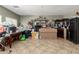 Spacious living room features tile flooring and a neutral color palette at 19719 N Castille Dr, Maricopa, AZ 85138