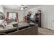 Spacious living room features tile flooring, a ceiling fan, and natural light at 19719 N Castille Dr, Maricopa, AZ 85138