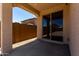 Covered back patio perfect for outdoor relaxation and entertaining, featuring a sliding glass door at 20128 W Jackson St, Buckeye, AZ 85326
