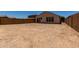 Spacious backyard area with block fencing, ready for landscaping and personalization at 20128 W Jackson St, Buckeye, AZ 85326