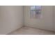 Bright bedroom featuring a window with blinds and neutral carpeting for comfort at 20128 W Jackson St, Buckeye, AZ 85326
