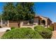 Single-story home featuring a two-car garage, desert landscaping, and a neutral color scheme at 20128 W Jackson St, Buckeye, AZ 85326