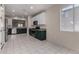 Spacious kitchen with stainless steel appliances, modern cabinetry, and tile flooring, creating a clean, functional space at 20128 W Jackson St, Buckeye, AZ 85326
