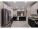 Kitchen featuring stainless steel appliances, contrasting cabinets, and an open layout, combining style with functionality at 20128 W Jackson St, Buckeye, AZ 85326
