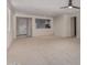 Bright living room with neutral carpet, ceiling fan, recessed lighting, and open layout at 20128 W Jackson St, Buckeye, AZ 85326