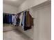 Spacious walk-in closet offers ample storage with clothing racks and neutral carpeting at 20128 W Jackson St, Buckeye, AZ 85326