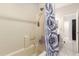 Clean bathroom showcasing a shower and an open entrance to the rest of the bathroom at 205 N 107Th Dr, Avondale, AZ 85323