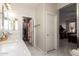 This is a well lit bathroom, with a double vanity and access to the bedroom and closet at 205 N 107Th Dr, Avondale, AZ 85323