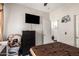 Bedroom boasting tile floors, a TV, and access to a bathroom at 205 N 107Th Dr, Avondale, AZ 85323