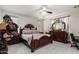 This is a spacious bedroom featuring a decorative bed frame and lots of natural light at 205 N 107Th Dr, Avondale, AZ 85323