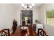 Open dining room features a dark wood table with seating for six at 205 N 107Th Dr, Avondale, AZ 85323