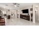 Spacious open-concept living area with tile flooring and a ceiling fan at 205 N 107Th Dr, Avondale, AZ 85323