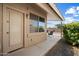 Charming covered back patio perfect for outdoor dining and relaxing, surrounded by lush greenery at 20814 N Dries Rd, Maricopa, AZ 85138