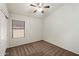 Comfortable bedroom featuring carpet flooring, ceiling fan, and a window at 20814 N Dries Rd, Maricopa, AZ 85138