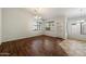 Bright dining room with wood floors, and a view to the backyard at 20814 N Dries Rd, Maricopa, AZ 85138