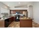 Well-appointed kitchen with stainless steel appliances, ample counter space, and a functional center island at 20814 N Dries Rd, Maricopa, AZ 85138