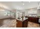 Open-concept kitchen and dining area with a view of the living area that is perfect for entertaining at 20814 N Dries Rd, Maricopa, AZ 85138