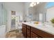 Beautiful main bathroom with dual vanity sinks and plenty of natural light at 20814 N Dries Rd, Maricopa, AZ 85138
