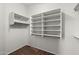 Organized walk-in closet with built-in shelving and ample storage space at 20814 N Dries Rd, Maricopa, AZ 85138