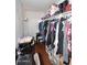 Walk-in closet featuring ample storage space with shelving, hanging racks, and plenty of space for a desk and chair at 2416 W Caribbean Ln # 2, Phoenix, AZ 85023