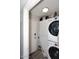 Efficient laundry room with stacked washer and dryer, plus extra storage space at 2416 W Caribbean Ln # 2, Phoenix, AZ 85023