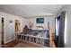Warm and inviting primary bedroom featuring a wooden four-poster bed and wood floors at 2416 W Caribbean Ln # 2, Phoenix, AZ 85023