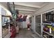 Covered outdoor storage area filled with bikes, tools, toolboxes, sporting equipment, and other miscellaneous items at 2416 W Caribbean Ln # 2, Phoenix, AZ 85023