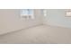Bright, spacious bedroom with neutral carpet and large windows providing natural light at 25347 N 176Th Ave, Surprise, AZ 85387