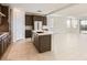 Beautiful kitchen with stainless steel appliances, large island with sink, and ample counter space at 25347 N 176Th Ave, Surprise, AZ 85387