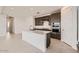 Bright kitchen featuring stainless steel appliances, a center island with quartz countertops, and sleek cabinets at 25347 N 176Th Ave, Surprise, AZ 85387