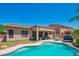 Inviting pool with step entry, backyard with patio, and desert landscaping at 26072 N 74Th Ave, Peoria, AZ 85383