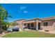 Expansive backyard view features lush greenery, a private pool, and covered patio at 26072 N 74Th Ave, Peoria, AZ 85383