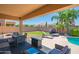 Inviting covered patio space, outdoor seating, fire pit, perfect for entertaining at 26072 N 74Th Ave, Peoria, AZ 85383