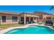 A well-maintained pool and covered patio create an inviting backyard oasis for relaxation and entertainment at 26072 N 74Th Ave, Peoria, AZ 85383