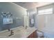 Bright bathroom with double sinks, shower-tub combo and decorative accents at 26072 N 74Th Ave, Peoria, AZ 85383