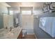 Clean bathroom with modern fixtures, including a bathtub and a framed mirror at 26072 N 74Th Ave, Peoria, AZ 85383