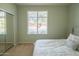 This bedroom is well-lit with mirrored closets and a neutral palette at 26072 N 74Th Ave, Peoria, AZ 85383