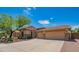 Attractive single-story home with a well-maintained front yard, desert landscaping, and a spacious driveway at 26072 N 74Th Ave, Peoria, AZ 85383