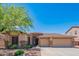 Beautiful single-story home featuring a well-maintained front yard, desert landscaping and a 3-car garage at 26072 N 74Th Ave, Peoria, AZ 85383