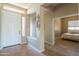 Welcoming home foyer featuring tile flooring, a decorative accent, and views into the bedroom and living spaces at 26072 N 74Th Ave, Peoria, AZ 85383